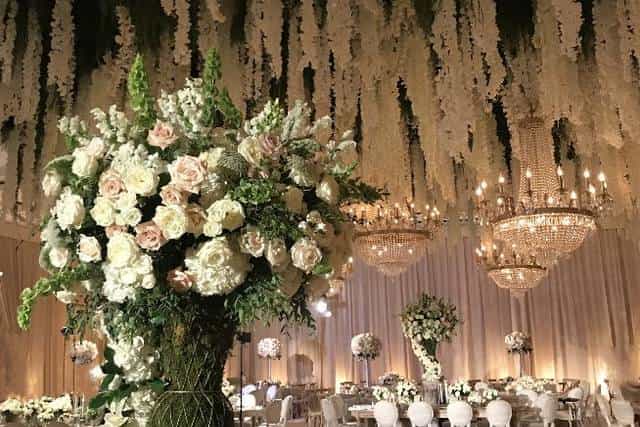 Elegant wedding venue at Sheraton Universal with floral arrangements and chandeliers.