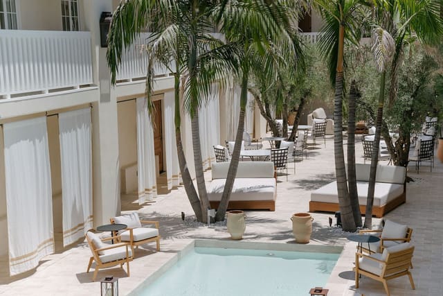 Balcony Rooms at Cara Hotel with pool, ideal for events and gatherings.