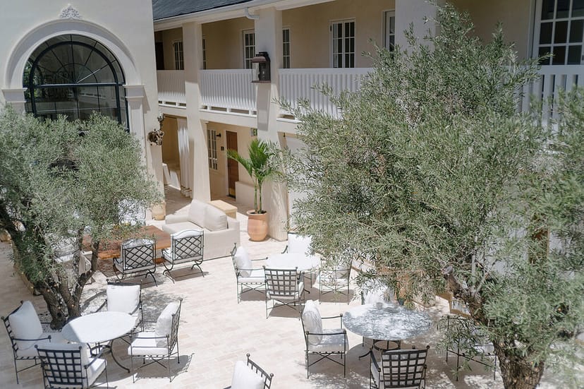 Serene outdoor courtyard at Cara Restaurant, ideal for intimate gatherings and networking events.