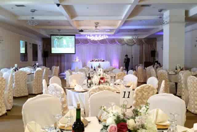 Elegant banquet hall with floral centerpieces for weddings and formal events.