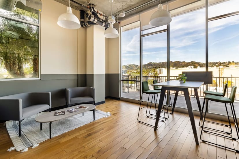 Modern meeting space with large windows in West Hollywood for networking events.