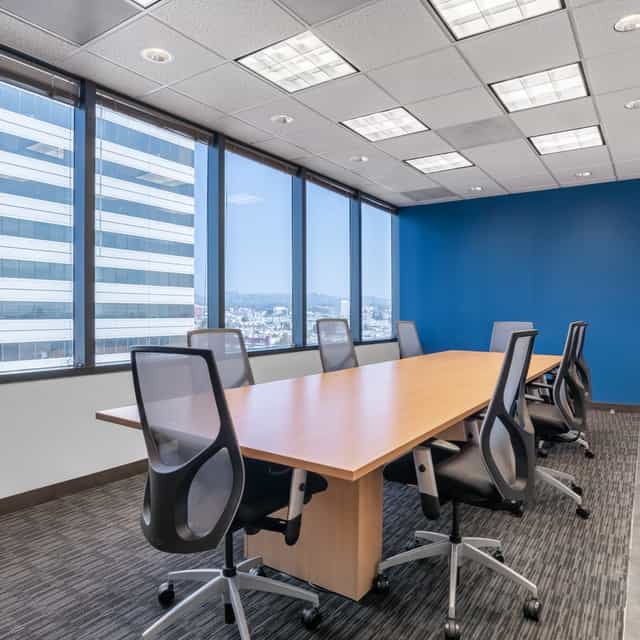Modern conference room with wooden table, ideal for corporate meetings in Central Park.