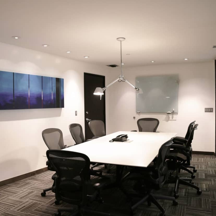 Modern conference room with sleek table in Central Park Business Center for meetings.