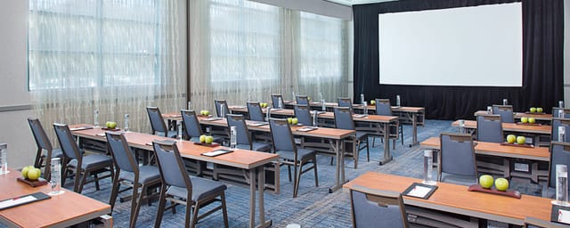 Meeting room in Central Park Business Center, set up for professional events with natural light.