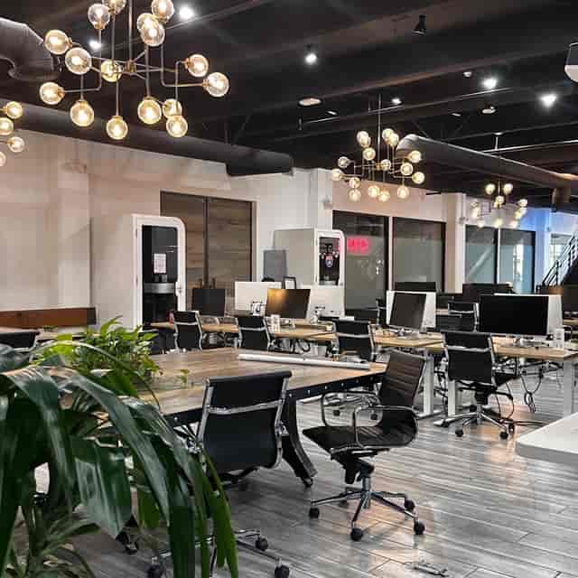 Modern executive suite with flexible seating for meetings and workshops.
