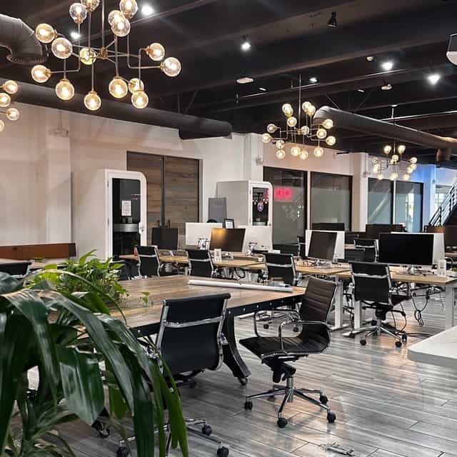 Modern executive suite with flexible seating for meetings and workshops.