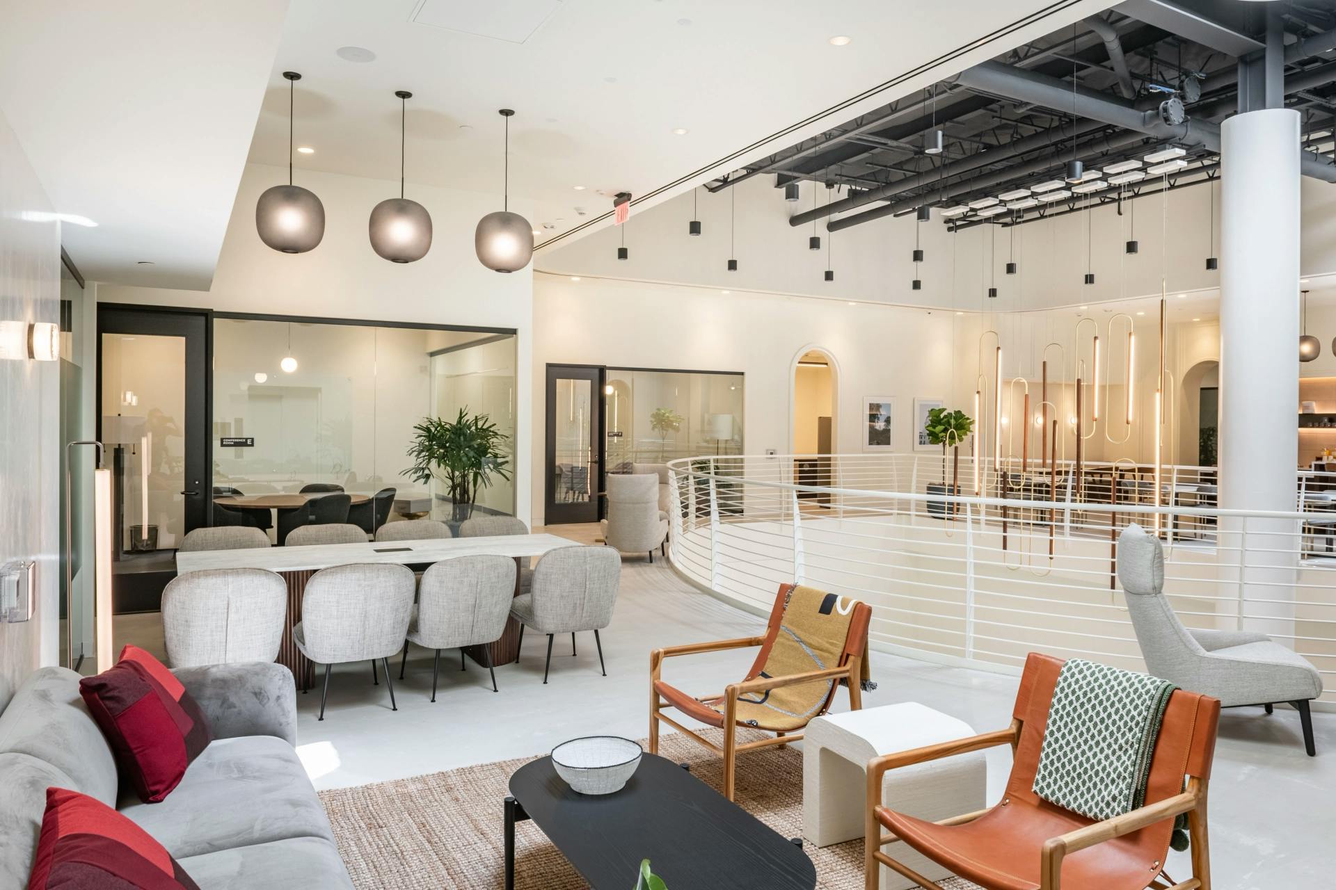 Modern open-concept executive suite for collaborative meetings and events.