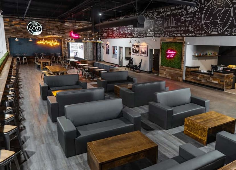 Paddock Lounge at K1 Speed Torrance, modern event space with comfortable seating for gatherings.