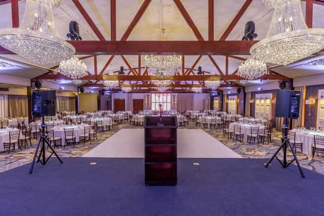 Main Ballroom at The Glen Arden Club, elegant setup for formal events and presentations.
