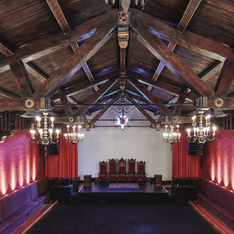 Performance stage in Grand Lodge of Los Angeles with wooden beams, ideal for events.