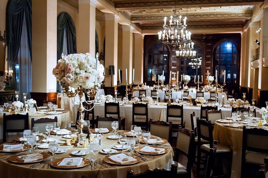 Elegant banquet hall with fine china, perfect for weddings and corporate galas.