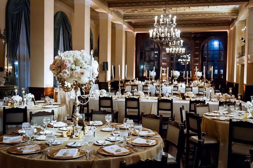 Elegant banquet hall with fine china, perfect for weddings and corporate galas.
