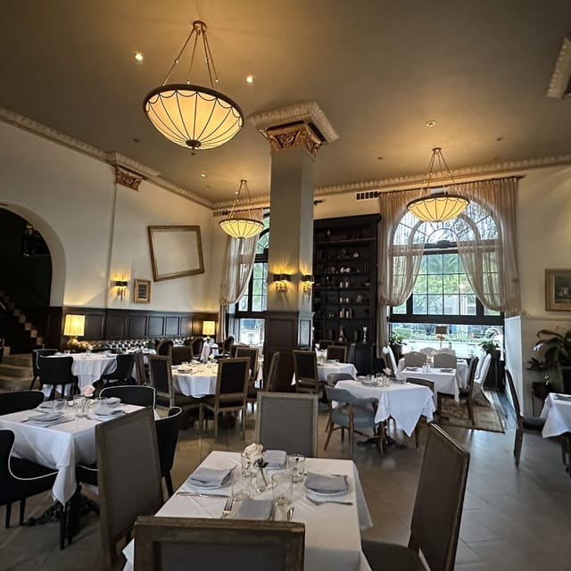 Elegant private dining room with natural light for upscale events in Cork & Batter.