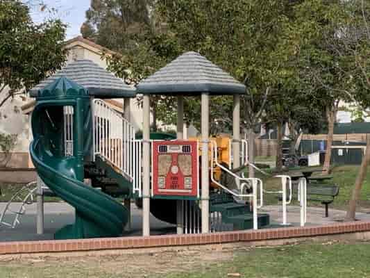 Alta Vista Community Center playground with slide, ideal for family events and gatherings.