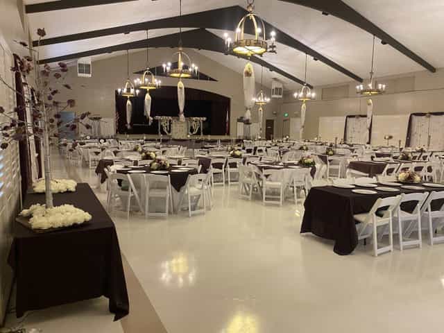 Griffith Park Visitor Center Auditorium with elegant tables, ideal for weddings and corporate events.