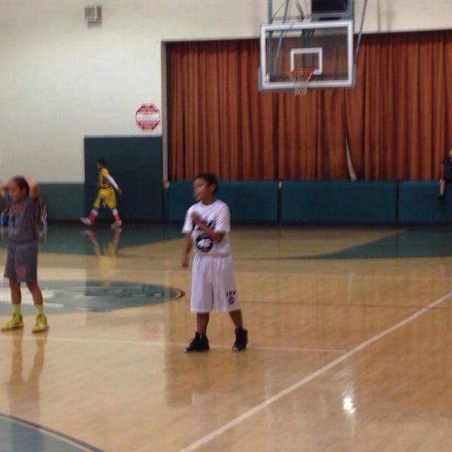 Basketball court at Victory Vineland Recreation Center for youth sports event.