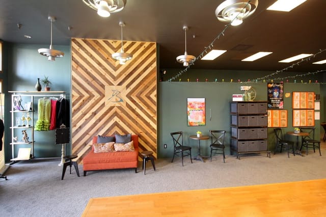 Practice Parties at Arthur Murray Dance Studio with stylish wooden wall and flexible seating.