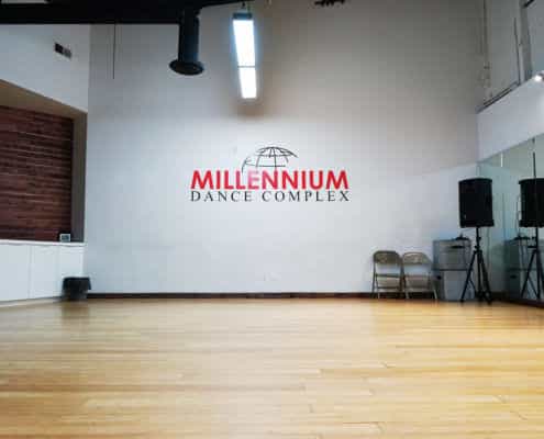 Spacious dance studio with polished wooden floor at Millennium Dance Complex for workshops.