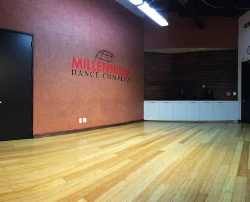 Spacious dance studio with polished floors for workshops and rehearsals at Millennium Dance Complex.