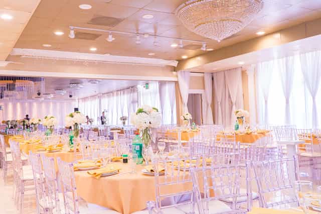 Elegant banquet hall with round tables, ideal for weddings and upscale events.