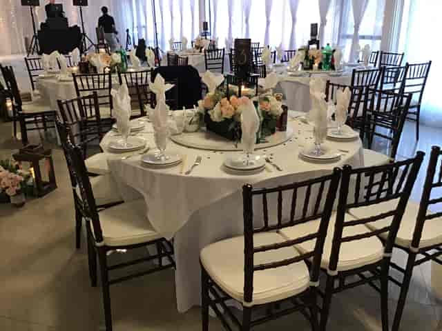 Elegant banquet hall with round tables, perfect for formal events and celebrations.