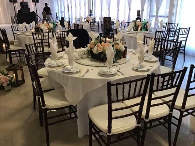 Elegant banquet hall with round tables, perfect for formal events and celebrations.