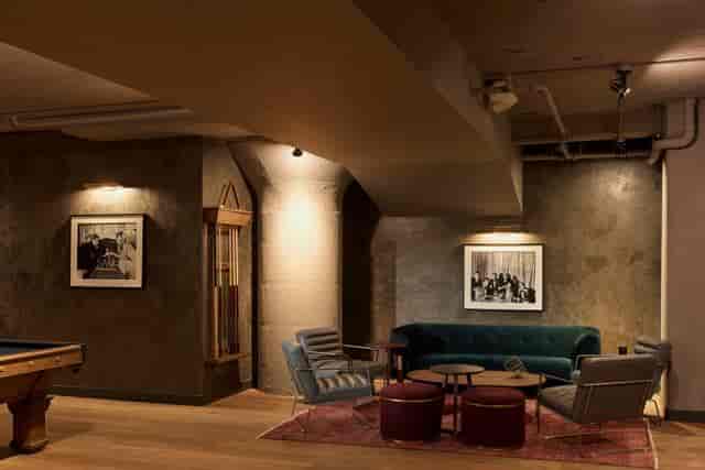 Stylish Mezzanine meeting space with warm lighting for intimate gatherings and brainstorming.