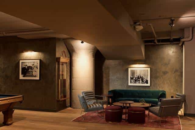 Stylish Mezzanine meeting space with warm lighting for intimate gatherings and brainstorming.