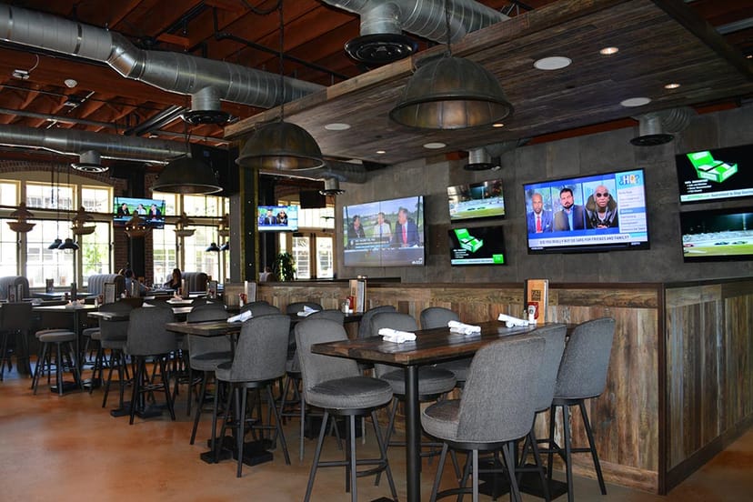 Modern restaurant space with high-top tables, ideal for casual meetings and events.