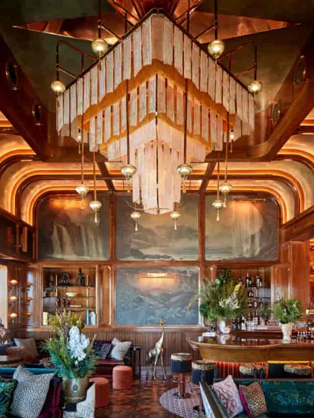 Elegant bar with chandelier in upscale event space for meetings and receptions.