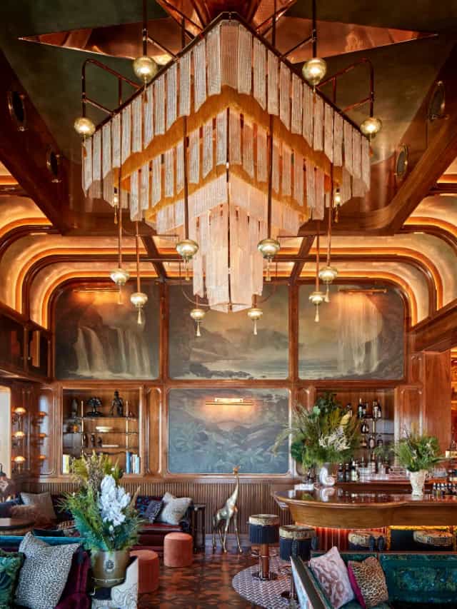 Elegant bar with chandelier in upscale event space for meetings and receptions.