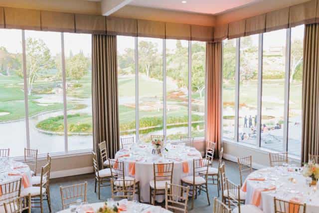 Elegant banquet room with floral centerpieces, perfect for weddings and corporate events.