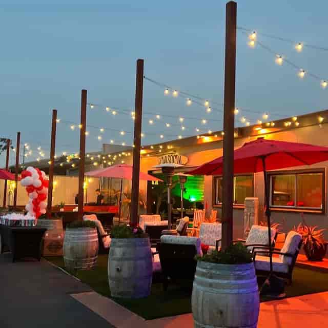 Outdoor event space at The Portside Social Club with string lights, ideal for gatherings.