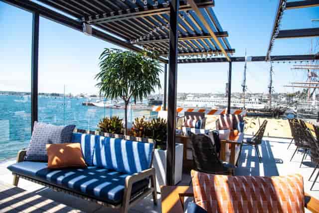Stylish outdoor venue at The Portside Social Club with waterfront view for events.