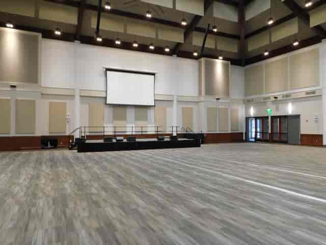 Main Hall at Liberty Station: spacious venue with elevated stage for conferences and weddings.