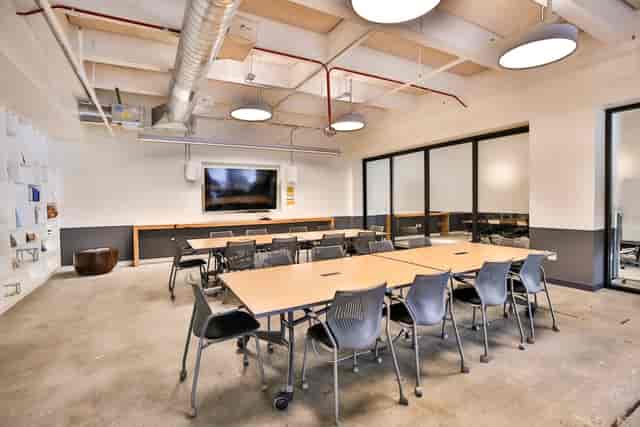 Modern conference room with ergonomic chairs, ideal for meetings and presentations.