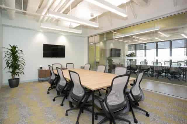 Modern conference room with ergonomic chairs for productive meetings and presentations.