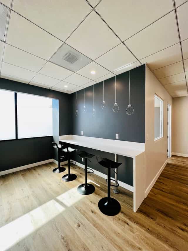 Modern meeting room Suite 410 with sleek design, ideal for brainstorming sessions.