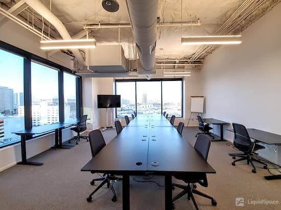 Modern meeting room with conference table, ideal for corporate events and brainstorming.