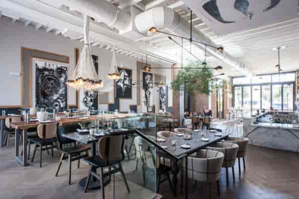 Modern restaurant bar in Norah, elegant decor for upscale dining and corporate events.