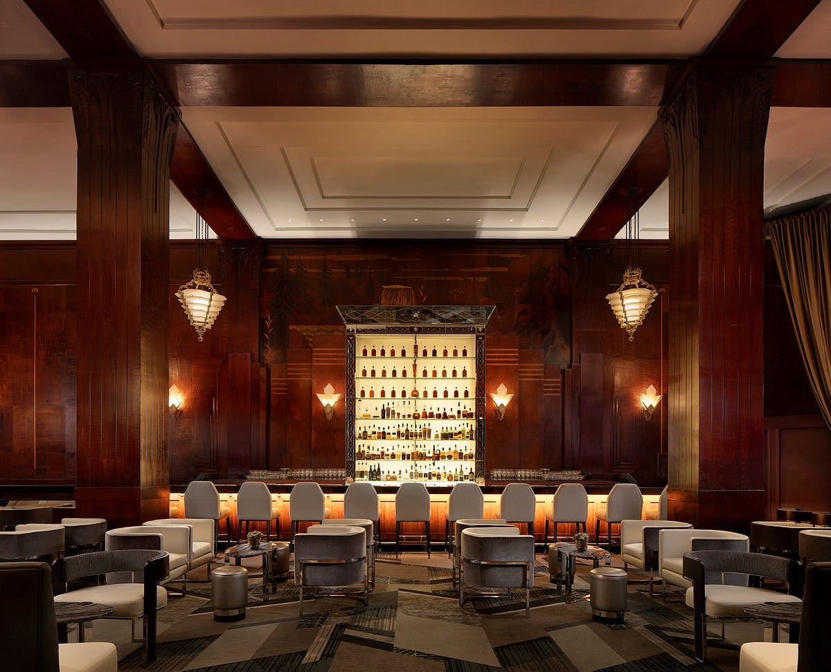 Elegant Redwood Room bar with rich wood decor, ideal for networking events and cocktail receptions.