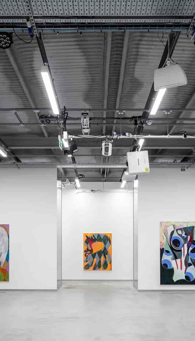 Modern White City Warehouse event space with advanced AV tech for hybrid meetings.
