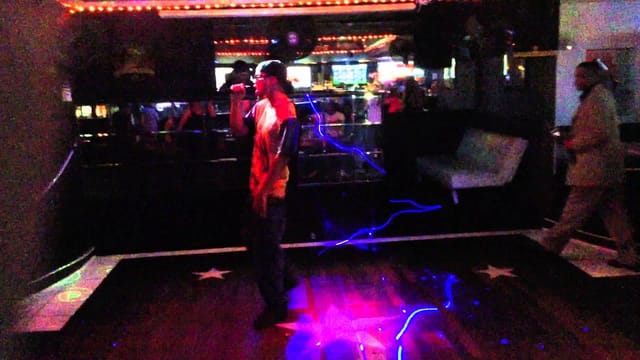 Vibrant Star Gazer Club event space with performer, ideal for parties and corporate events.