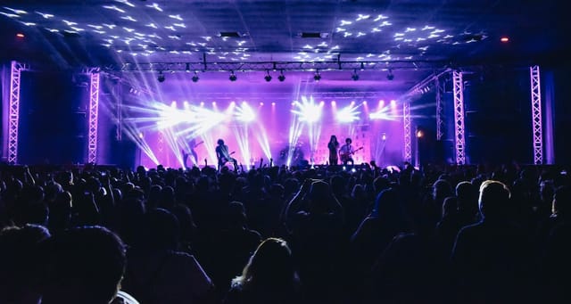 Vibrant concert scene at Side Stage, SOMA San Diego with dynamic lighting and engaged audience.