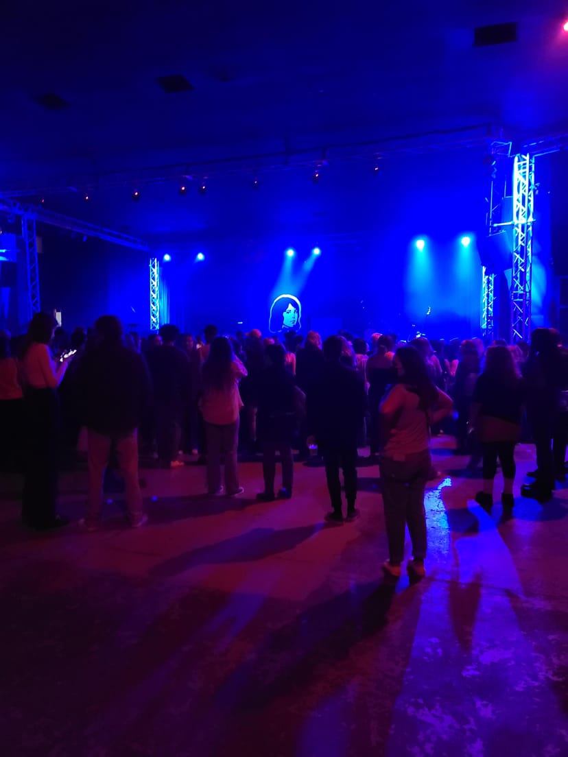 Vibrant Side Stage at SOMA San Diego with blue lighting for live music events.
