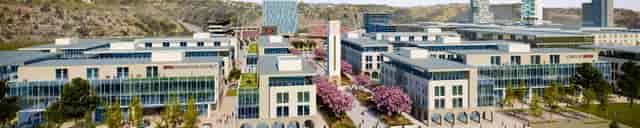J1772 at SDSU Mission Valley: modern venue with lush landscaping for outdoor events.