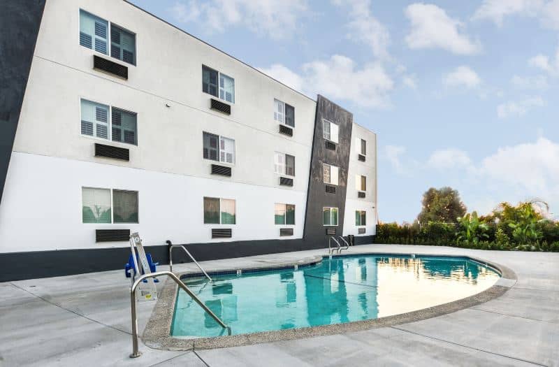 Outdoor pool at Hollywood Suites Inn, ideal for events and networking.