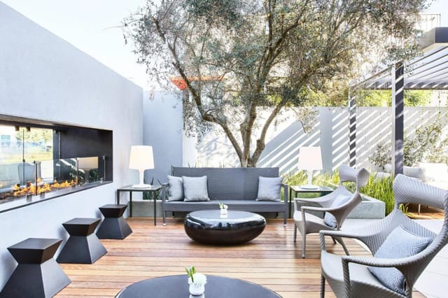 Stylish outdoor lounge at AC Kitchen, perfect for networking events and casual meetings.