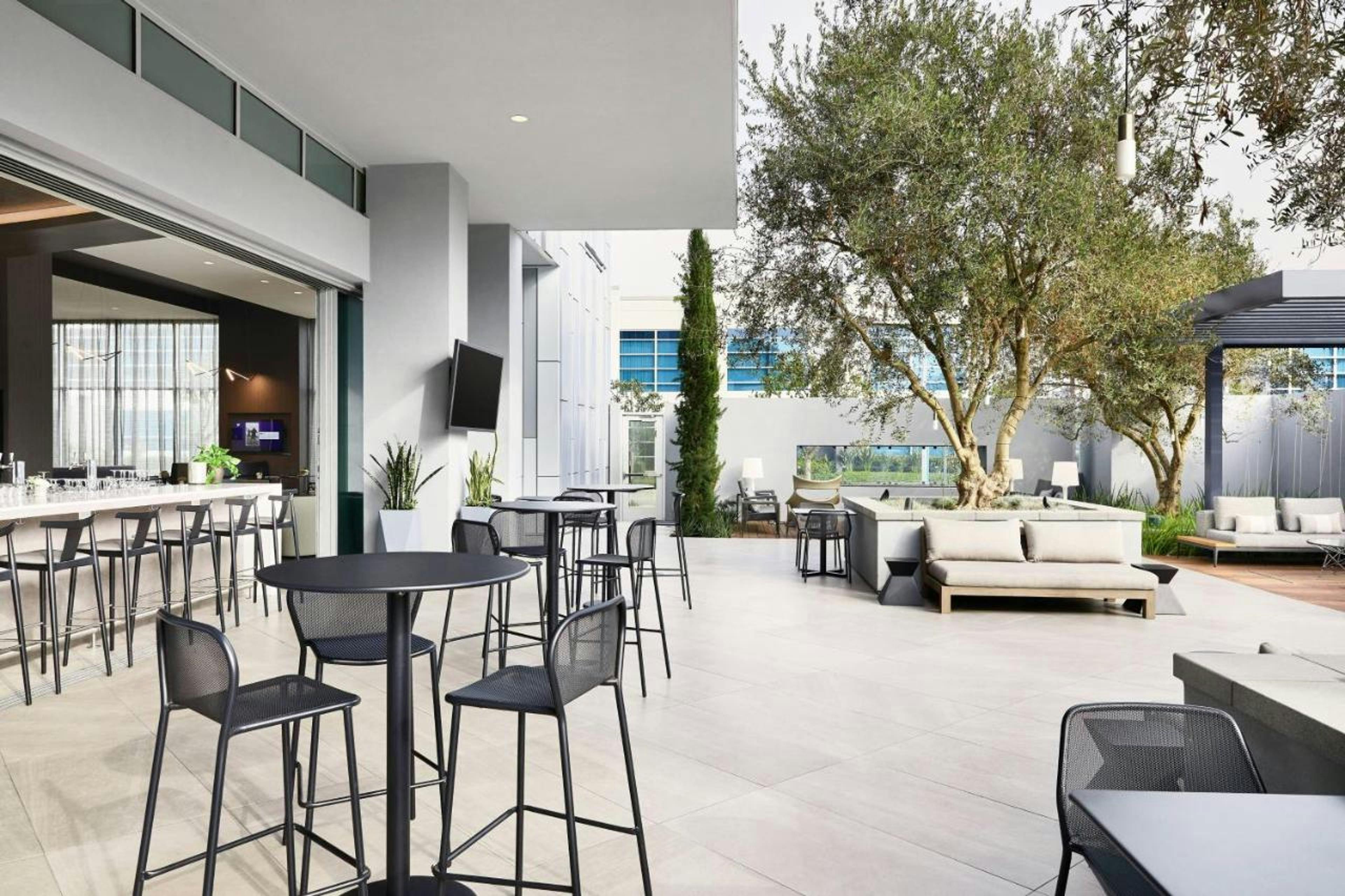 Modern outdoor event space at AC Kitchen, ideal for networking and cocktail receptions.