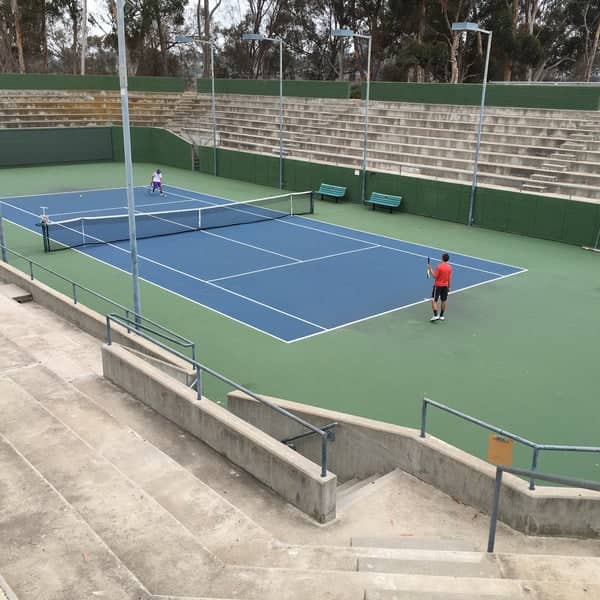 Tennis match at Balboa Tennis Club with vibrant court, ideal for tournaments and events.